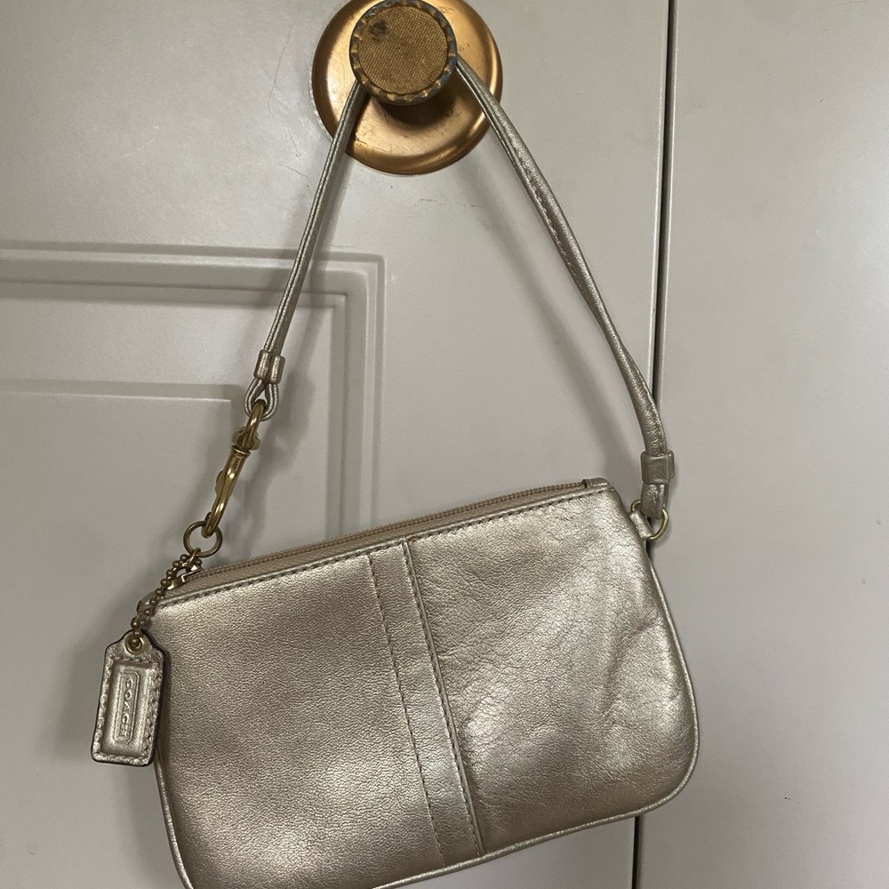Coach wristlet in gold
